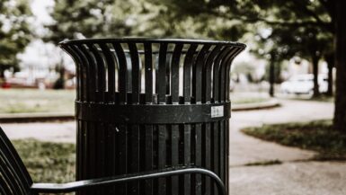 black steel trash bin during daytime